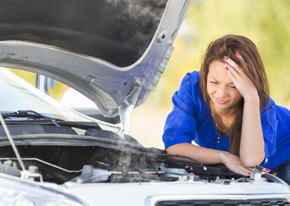 girl with a broken car