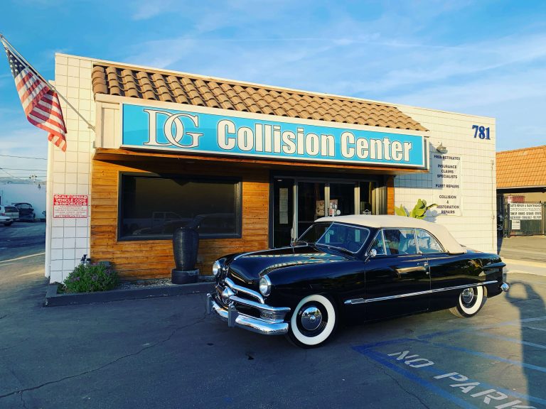 Classic black car with white roof repaired at DG Collision Center