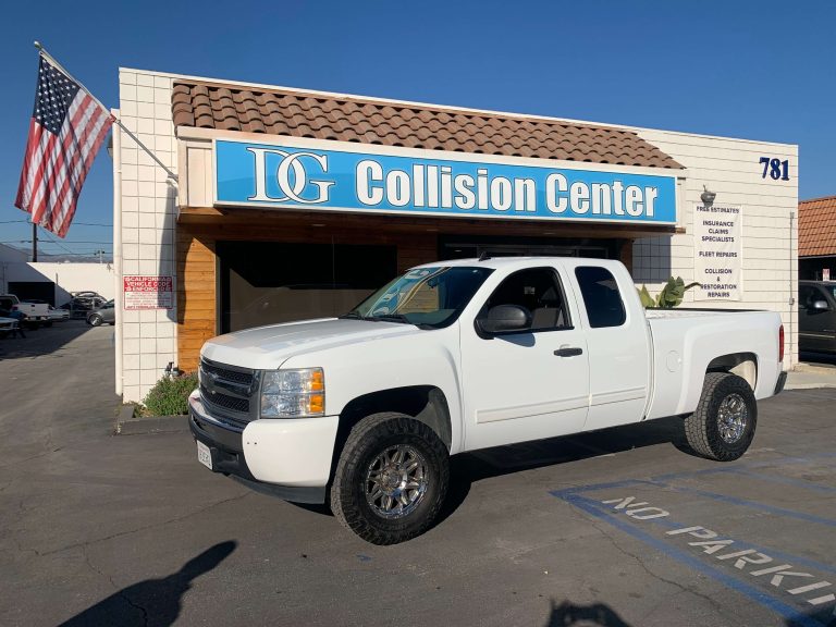 DG Collision Center repairs white pickup truck after collision