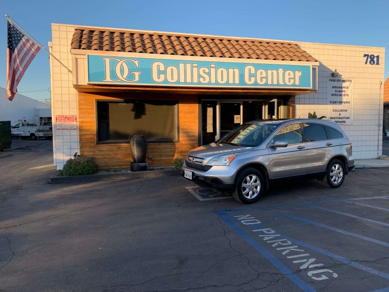 Gray car after collision repair parked before DG Collision Center
