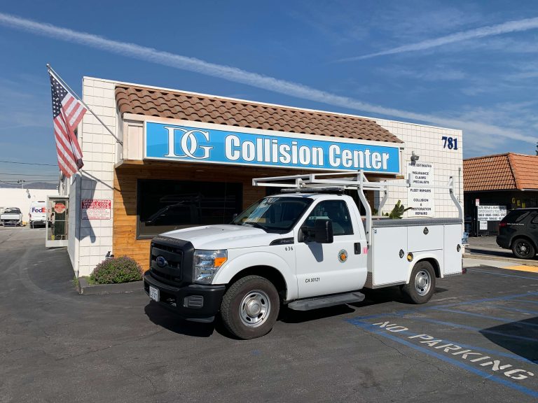 DG Collision Center repaired white pickup truck