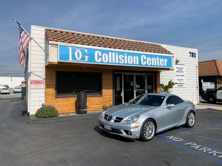 Gray car after collision, repaired and parked at DG Collision Center
