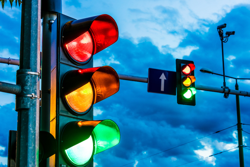 Traffic lights over urban intersection. Red light