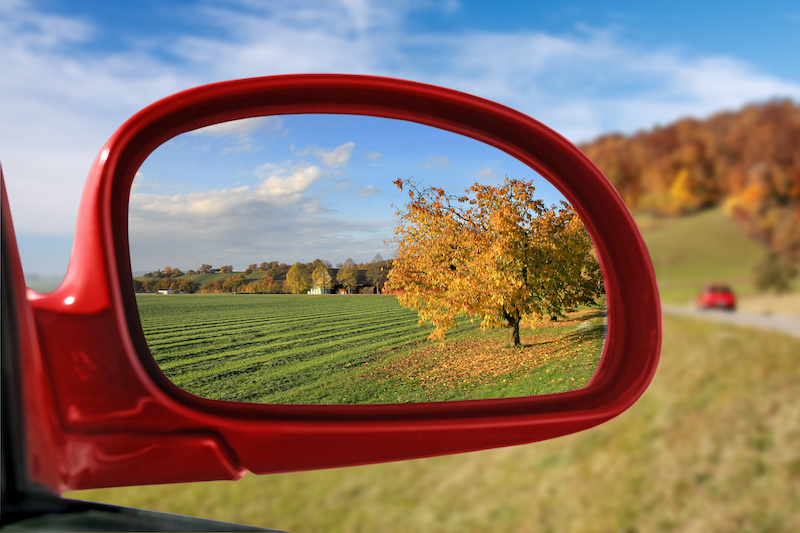 autumn fall in car rearview mirror