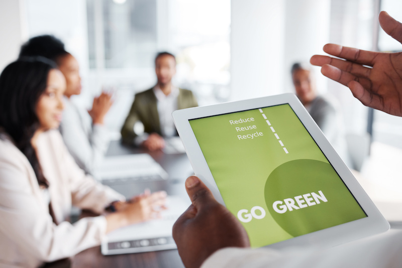 Go green, business meeting and people on tablet screen for sustainable project, eco friendly investment and growth. Paperless or vegan presentation, sustainability and man speaker speaking to clients.