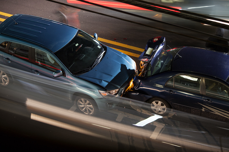 Overhead view of a car accident on a busy street