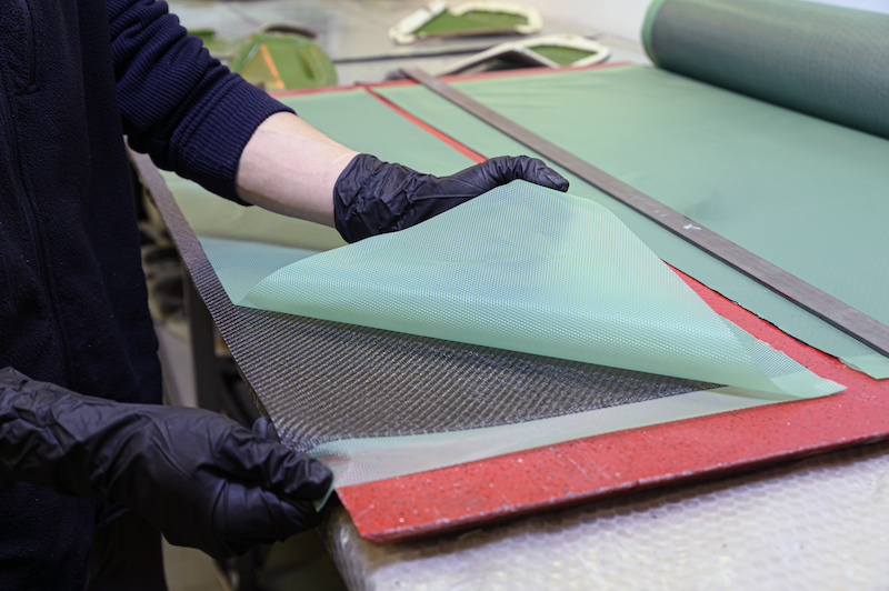 Preparation and cutting of a real carbon fiber sheet for the industrial production of a component for sports cars