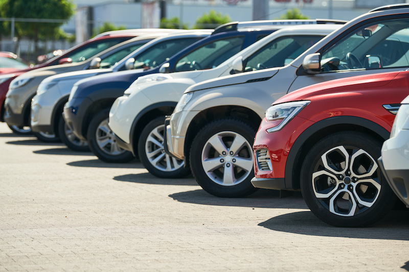 row of used cars. Rental or automobile sale services at dealer place