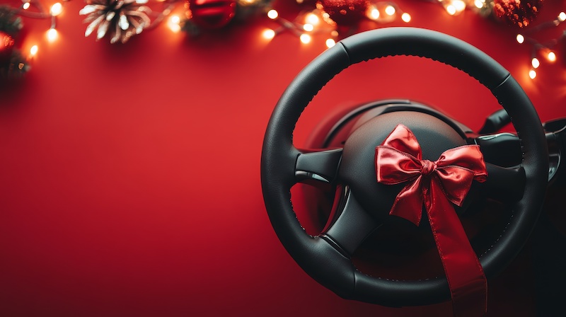 Steering wheel covers isolated on red christmas background with bow ribbon present