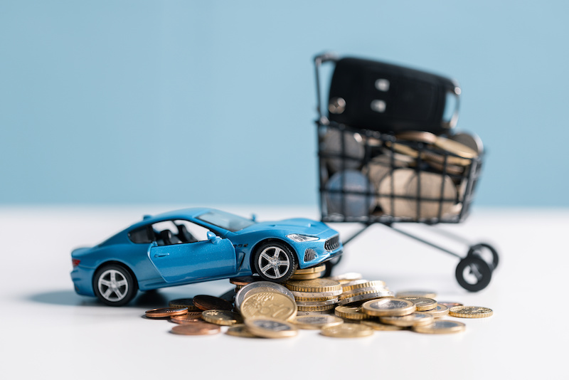 Buy a car, save money and consider the total fiscal value, market worth, and insurance costs. car, money, save, insurance, buy, fiscal, worth, market, total, value, concept.