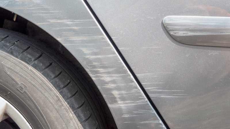 a close up of scratches on the car body