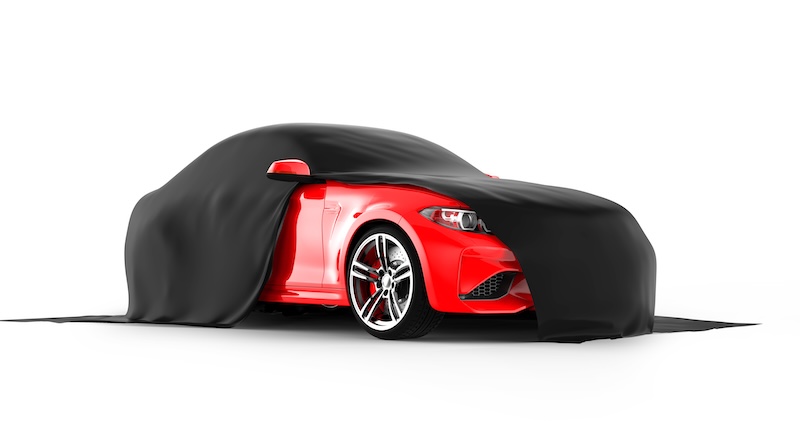 Modern red sports car presentation with black cloth: 3D illustration