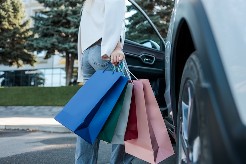A woman is holding multiple shopping bags as she exits a car, likely after a shopping spree. The bags are colorful, suggesting a variety of purchases. SSUCv3H4sIAAAAAAAACpySz27DIAzG75P2DhHnRqIljcJepdrBAZZYJVAB6TRVfffxJ6nYdbf4Z/uzP5zH+1vTkBE8CvLRPFIUY9R69cFBQGsipoeNO2WkcjW5O9bTGgDWkZIYrEPQNRwhiNnAoiI0q9YJP3OS+ABh9cqnXTYkIKgpahT4kigLX0rc7ImcjB0xRcihYn4dM9tREf9XZ/n4fBmelBE/eeHKiFNaQTFyKaXk+h2UW2prsEq0lau7FaBTAauUAG/g4E/fzaFAM1XEhjnfZVcSdjXBpa1eZoi29gajTq/+Fceonc/gfSyXO69mi/gX2KWaY2zInjZVIuNxUnhkHT2dzv1wHCjtKON8KygHnTHq5HV2oRiLK8raFaYNiBw47/lwbo9CsrYDxlrOu1M7CEr7vhsYSBVv8fwFAAD//wMAJYVN4LkCAAA=
