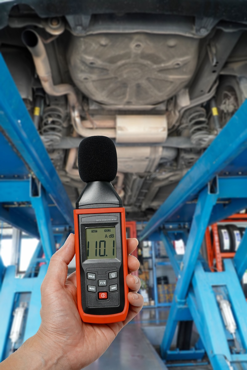 Sound meter,mechanic uses a sound level meter under the car to determine the noise level of the car's suspension.