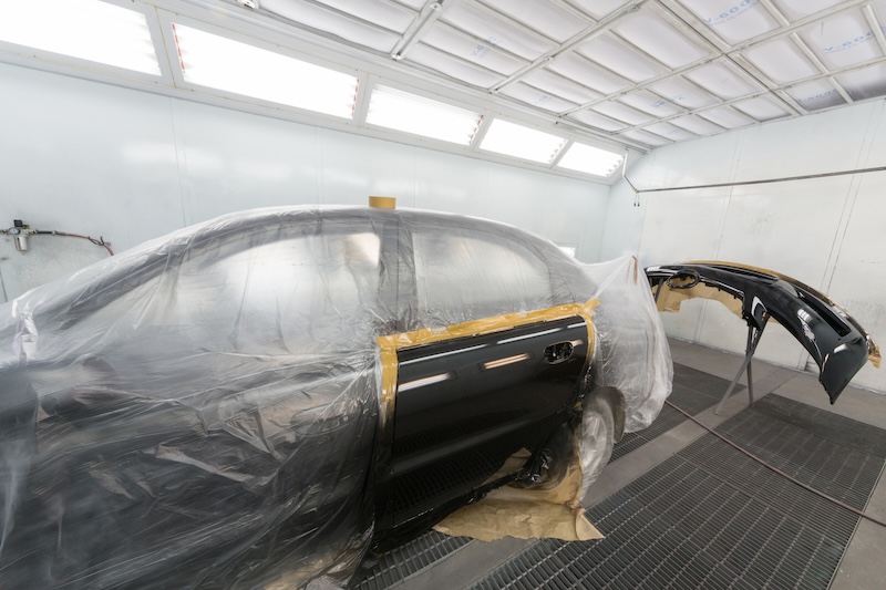 MOSCOW - SEP 21: Car door and bumper after painting on body shop Avtostandart on September 21, 2012 in Moscow, Russia.