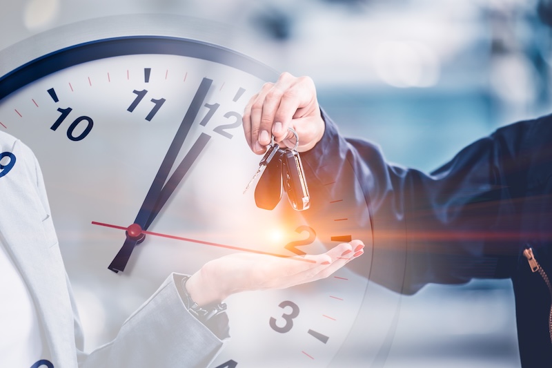 people giving car to hand overlay with time clock for times to repair service a car replace schedule