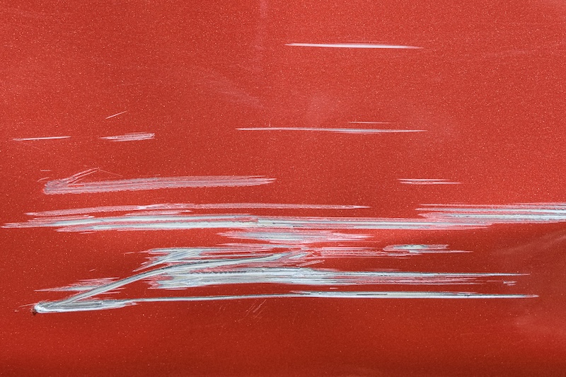Close up of a red car with multiple visible scratches and paint damage The scratches expose the underlying metal, creating a contrast against the glossy surface. Perfect for automotive damage concepts SSUCv3H4sIAAAAAAAACpySwW7DIAyG75P2DhHnRqIJVGyvUu3gENKgUqiAdJqqvvsMJBG77hZ/tn/7x3m+vzUNGSBoST6bZ4ow1sYsIXqI2lnE9LByr+yofE0evj/RGoCuIzXq6LwGU8MBopwt3BRCuxiT8CsnSYgQl6BC2mVFEqK6oEaBu0RZ+FziZkvkJHZgipBDxcIyZLahIv6vzvLxtRu+KCt/8sKVEa+MgmLkXErJ9Tsqf6utwTJqV7l6OAkmFfSVEug7ePjTd/daanupiItzvsumJN1io09b7WaIce4Og0mvPuEYtfEZQsDycePVbIl/gbtVc6yL2dOqSkY8TgqPfS84F5xRzhilHe3WgnLQWaNOXmcTwlhe9Vi70mkD0k8d8EGIltFT17KjnFoBlLUfnZCSiSPlHPAWr18AAAD//wMA9SLfwLkCAAA=