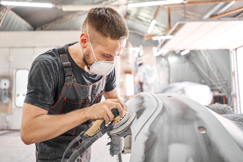 The mechanic works with a grinding tool. Sanding of car elements. Garage painting car service. Repairing car section after the accident SSUCv3H4sIAAAAAAAACpRSy27dIBTcV+o/WKxriZdf+YMsKnUfdYGBe43CBctAmyq6/56DbSJSqVW7MzOemfN6/fypadAsgpHooXnNL3gba1OIm4jGO4DxlxPftFN6qxGtTPSbEbYGZxHl4sRNA+iStRm+7yQKUcQUdKjCwpJi1FuIXj4DzIrLal6iAIBUcimivkLeB4NS/dPxbgqxk6AACj06lTvKhZ7+R3aaM/vVBKmtFU77FFDhj8w/GH7TfrX6P8yOj++lO3HVTv7KXdyr/jZttTjGc3aDhqHXveK4HaZJtbzrLq2g49wqimc6TOTCO7mnHNbo+ScM87bP5zQVSRlfzeuHl8LmH1iVvG5GGnetZD4u+66LTPrk4pZLRmToSufIer+KGUbx0FzAVhd8ESGAQhW83iKswt+qKOfj3jM6XJGCNe85jPJ+GAc84IliPPER1We0GPDZKyo1ptV6oXQOfd/Z7wdGekwpJYSXe61vDTgGqYweVDmBvNubAZd/cKYj56f6w+HDP0b95fARGRnGhOAJ7/s8hSZHIsrnEebA2svIaMsJ6VvRdbIFhZ7UzIjCE6jubwAAAP//AwB4R4CF0AMAAA==