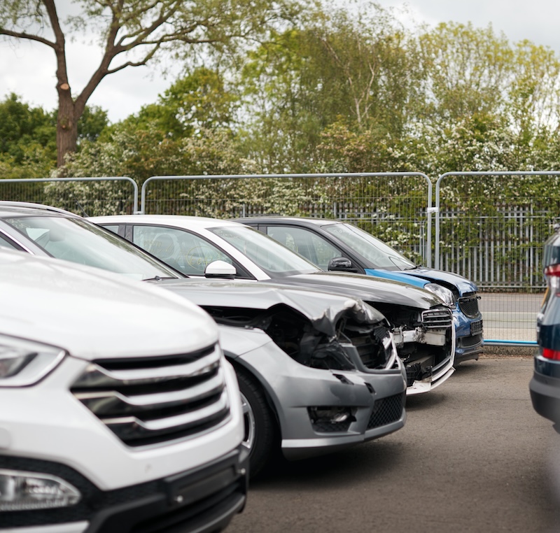 Cars Damaged In Motor Vehicle Accidents Parked In Garage Repair Shop