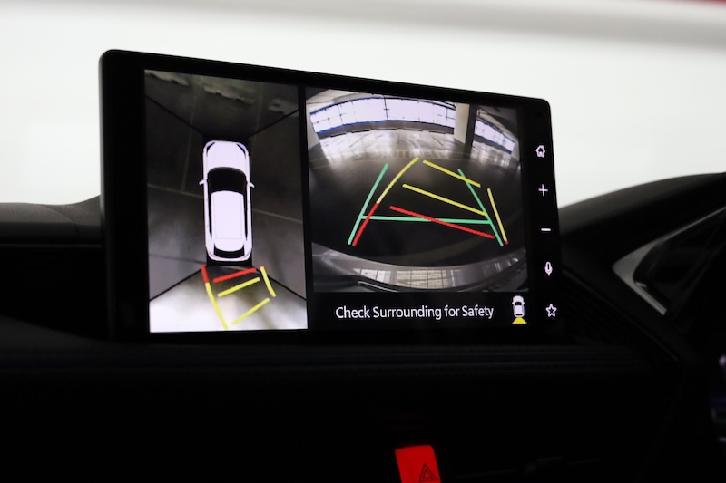 Car display showing rear and top view parking camera.