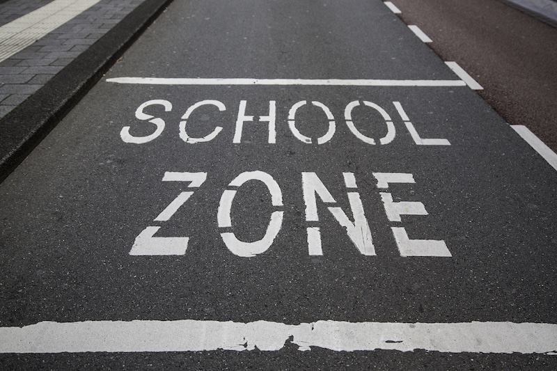 School sign on the asphalt, information traffic sign
