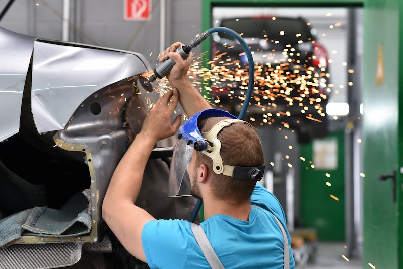 repair car body by a mechanics in the workshop