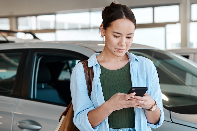 Asian woman, typing and phone at car dealership to sale, customer and website for research. Female person, communication and mobile app for vehicle review or online survey, showroom and social media. SSUCv3H4sIAAAAAAAAA22Q0WrDMAxF/0XPeXCcNG3zK2MMxfYa0cQutrxRSv59shMYjL3piivpXL1gwkQGxhfQsuTEEZmCh1E1EJ23LtbyK3aDqpWzxCESLlVNyGb2uDoYIc0h8MdFX9r+Cg0giWNrIDFyTi7JCVEG2d1kvurf29KWDTKV8lQKcap/+1vBWhzWhW+gB6VV3/Zdh/p8PQ3i/NM6w3sD9292cT0QMFsKe/mIZMjfdhF4LmkrpTwirAUgzZllVqS5F73H94EdPx+SuhW0TyM4Pq9TGYe2G069VrqyFmPaE1hJfmSpH5lJlsbnfrDuJ3sQ5scS0HKBBLRhcsf5dtt+AOedo9ewAQAA